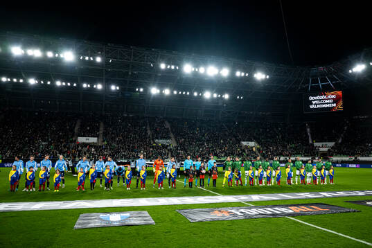 The teams at line up ahead of the UEFA Europa League football match between Ferencvaros and Malmö FF on November 28, 2024 in Budapest. 