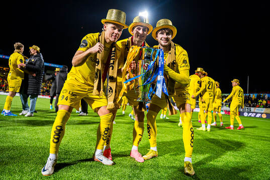 August Mikkelsen, Fredrik Sjøvold and Håkon Evjen of Bodø/Glimt celebrates with the trophy