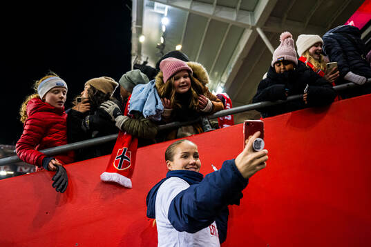 Guro Reiten of Norway with a fan