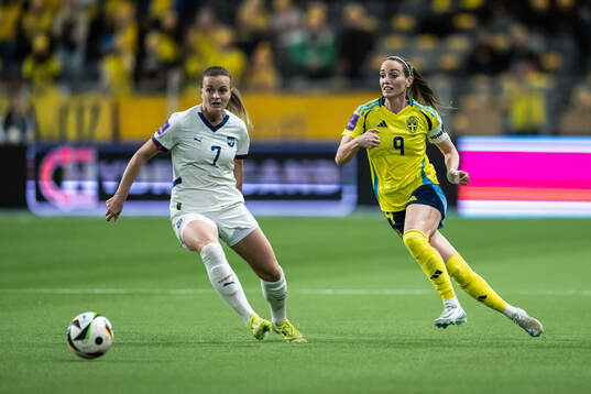 Milica Mijatovic of Serbia and Kosovare Asllani of Sweden