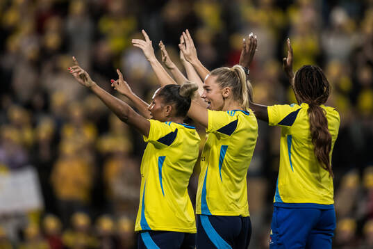 Madelen Janogy and Fridolina Rolfö of Sweden celebrate