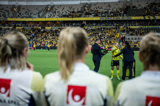Jonna Andersson of Sweden is celebrated for 100 games with Head of football Kim Källström and General secretary Andrea Möllerberg of the Swedish Football Association ahead of the UEFA Women's Euro Qualifier play-off football match between Sweden and Serbia on December 3, 2024 in Stockholm.