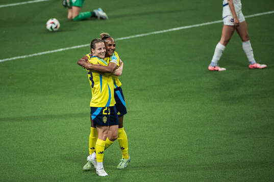 Anna Anvegård and Madelen Janogy of Sweden celebrating the 6-0 goal