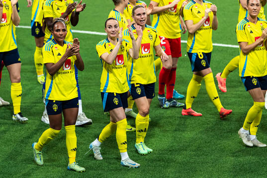 Madelen Janogy and Kosovare Asllani of Sweden celebrate