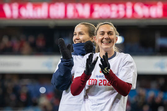 Guro Reiten and Vilde Bøe Risa of Norway celebrate