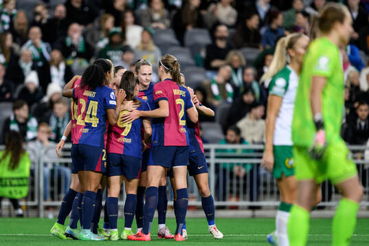 Ewa Pajor of Barcelona celebrates with team mates after scoring 0-2
