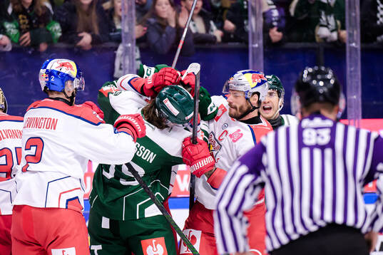 Linus Johansson of Färjestad  and Thomas Raffl of EC Red