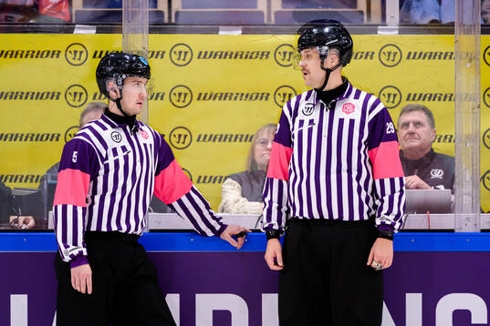 Referee Janne Wuorenheimo and Lassi Heikkinen