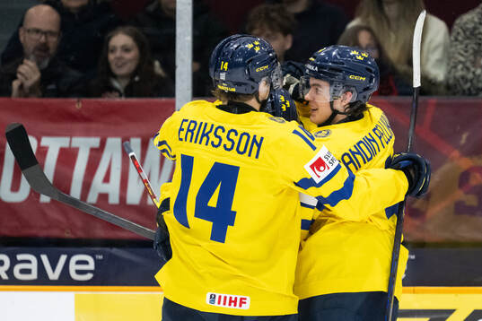 Rasmus Bergqvist celebrates with Linus Eriksson and Axel