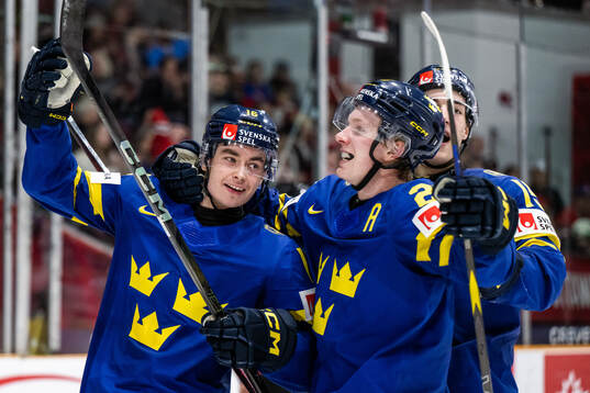 Felix Unger Sörum of Sweden celebrates with Otto Stenberg