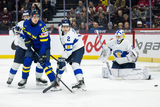 Rasmus Bergqvist of Sweden against Mitja Jokinen and Topias