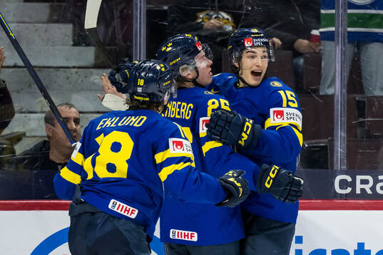 Otto Stenberg of Sweden celebrate with Victor Eklund and