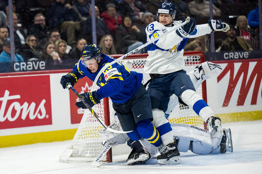 Goaltender Petteri Rimpinen and Veeti Väisänen of Finland