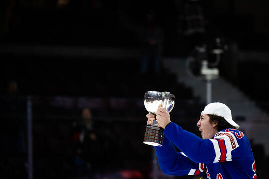 Austin Burnevik of USA celebrates with the trophy
