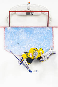 Goaltender Marcus Gidlöf of Sweden with a save
