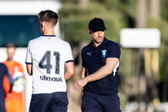 William Åkesson and Head coach Henrik Rydström of Malmö FF