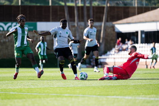 Jonathan Karlsson of Hammarby and Nouhou and Goalkeeper