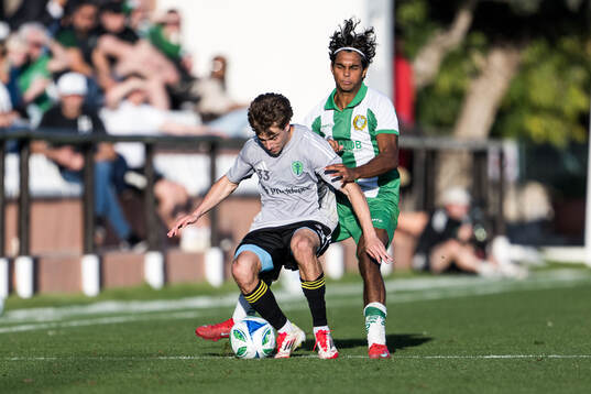 Cody Baker of Seattle Sounders FC and Jonathan Karlsson of