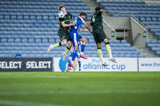 Conor McManus and Josh Stephenson of Brentford B and Ramon Pascal Lundqvist of IFK Göteborg