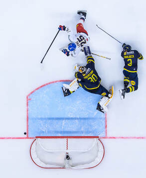 Radan Lenc of Czech Republic challenges goaltender Linus