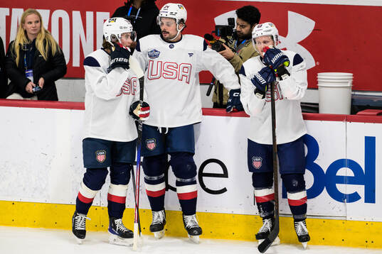 Jack Hughes, Auston Matthews and Jake Guentzel of USA at a