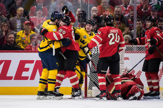 Filip Forsberg and Gustav Nyquist of Sweden and Drew