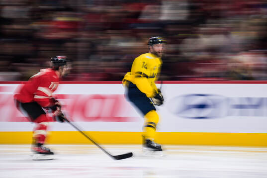 Travis Konecny of Canada and Mattias Ekholm of Sweden