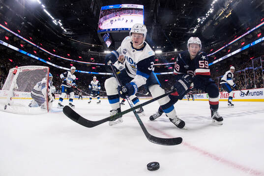 Olli Määttä of Finland and Jake Guentzel of USA