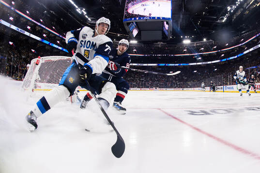 Niko Mikkola of Finland and Zach Werenski of USA