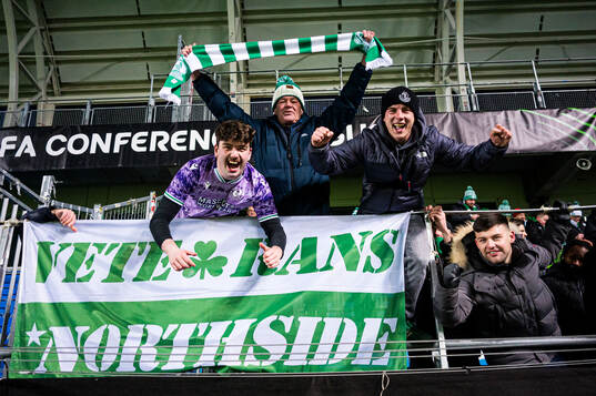 Spectators in the stands celebrates