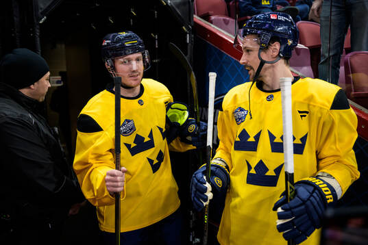 Gustav Nyquist and Erik Karlsson of Sweden at a practice