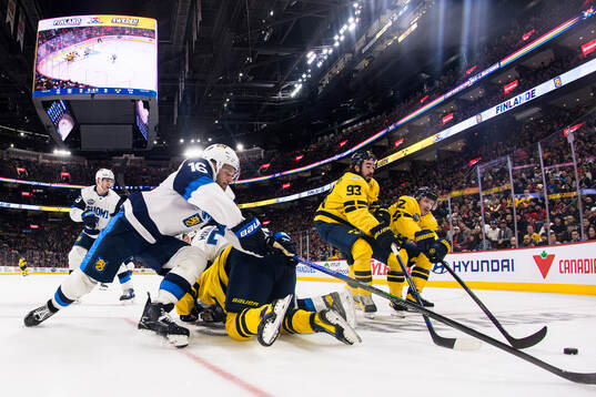 Aleksander Barkov of Finland in action against Mika