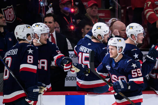 Jake Guentzel of USA celebrates with teammates