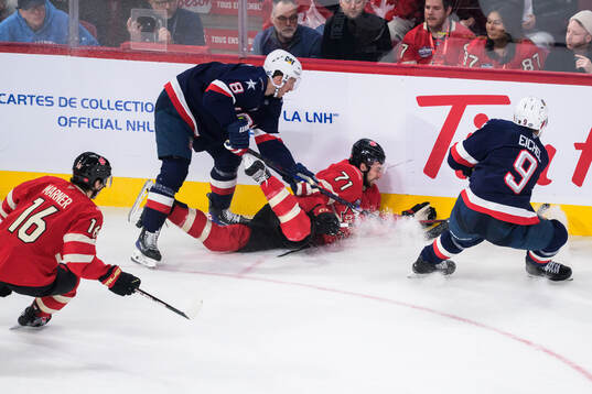 Mitch Marner and Anthony Cirelli of Canada are being