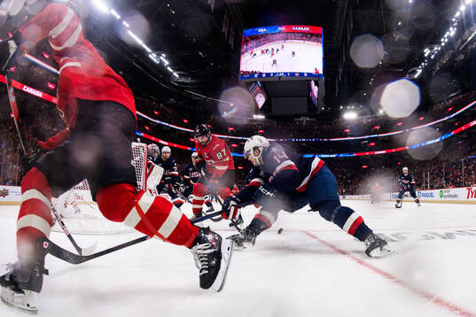 Goaltender Connor Hellebuyck and Brock Faber of USA are
