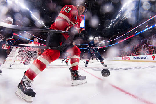 Zach Werenski and Auston Matthews of USA are being