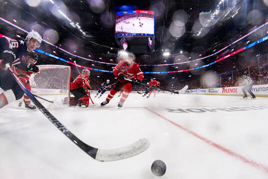 Jack Hughes of USA and Travis Sanheim of Canada
