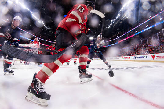 Zach Werenski and Auston Matthews of USA are being