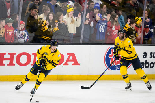 Elias Pettersson and Mattias Ekholm of Sweden at warm-up