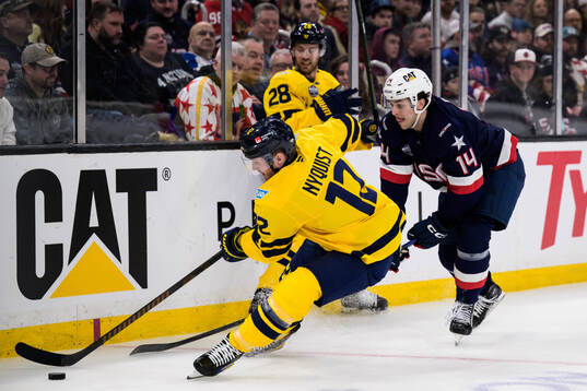 Gustav Nyquist and Elias Lindholm of Sweden in action