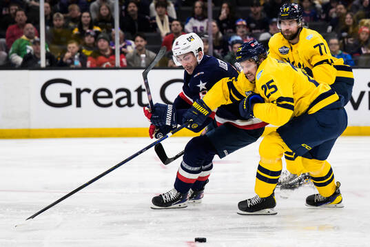 Zach Werenski of USA in action against Jonas Brodin and