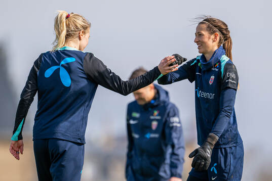 Ada Hegerberg and goalkeeper Cecilie Fiskerstrand of the