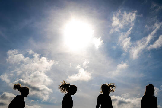 The silhouettes of Justine Kielland, Tuva Hansen, Mathilde Harviken and Maren Mjelde of the Norwegian women's national football team