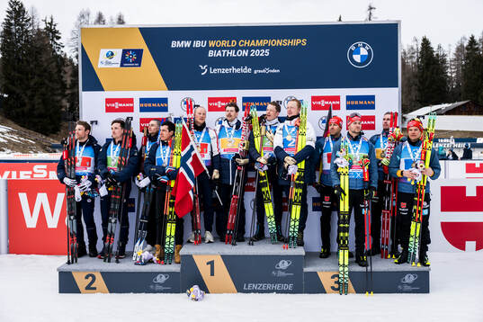 Silver medalists Emilien Claude, Fabien Claude, Eric Perrot and Quentin Fillon Maillet of France, gold medalists Endre Strømsheim, Tarjei Bø, Sturla Holm Lægreid and Johannes Thingnes Bø of Norway and bronze medalists Philipp Nawrath, Danilo Riethmueller, Johannes Kuehn and Philipp Horn of Germany celebrate on the podium at the medal ceremony for men's 4 x 7,5 km relay
