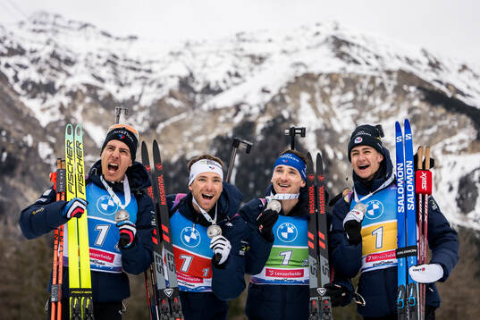 Silver medalists Emilien Claude, Fabien Claude, Eric Perrot and Quentin Fillon Maillet of France celebrate as they pose for a photo after the medal ceremony for men's 4 x 7,5 km relay
