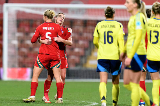 Rhiannon Roberts and Angharad James celebrate