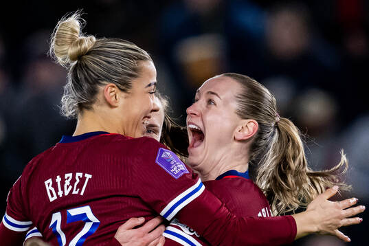 Elisabeth Terland of Norway celebrates with teammates