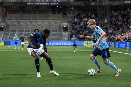 Derrick Luckassen of Pafos and Oskar Fallenius of Djurgården