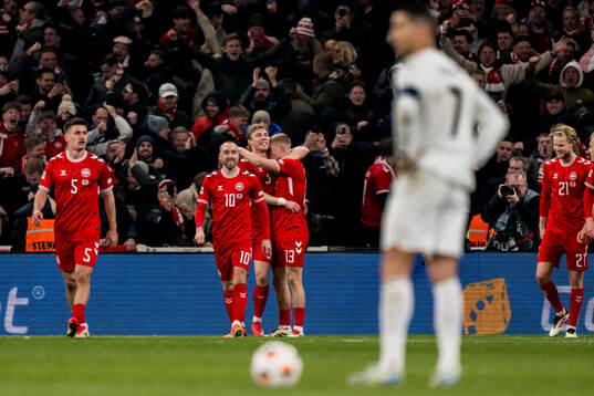 Rasmus Højlund of Denmark celebrates after 1-0