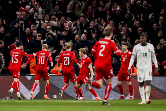 Rasmus Højlund of Denmark celebrates after 1-0